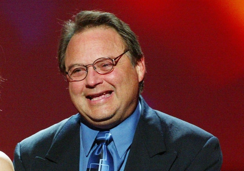 Stephen Furst smiles on stage