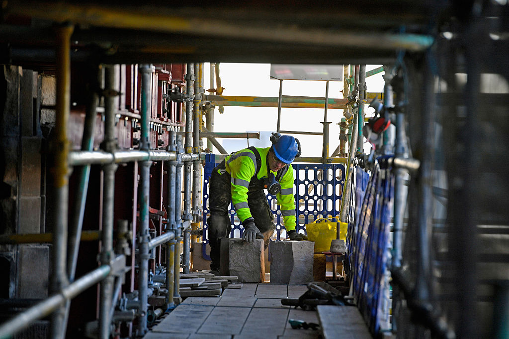 A stonemason using the skills he learned during his apprenticeship