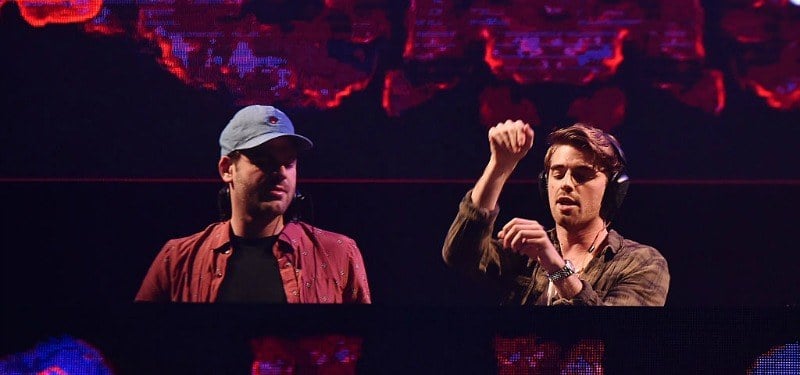 The Chainsmokers are behind the DJ booth together.