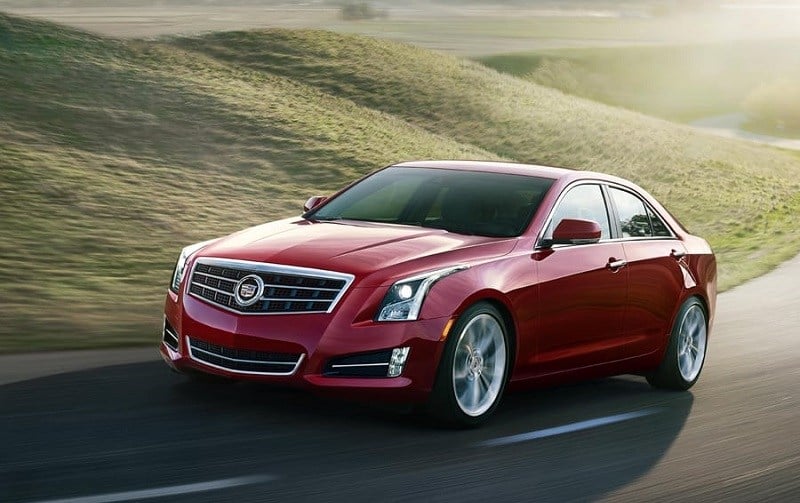 Front three quarter view of red Cadillac ATS, 2014 model year, from driver side