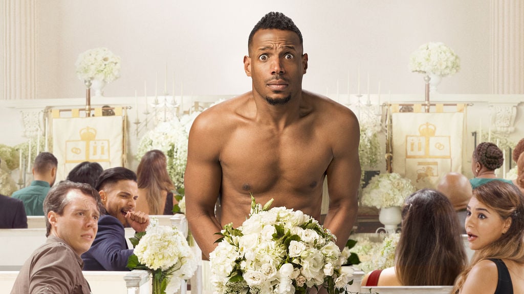 A naked Marlon Wayans covers himself with a bouquet of flowers in a crowded church A naked Marlon Wayans covers himself with a bouquet of flowers in a crowded church