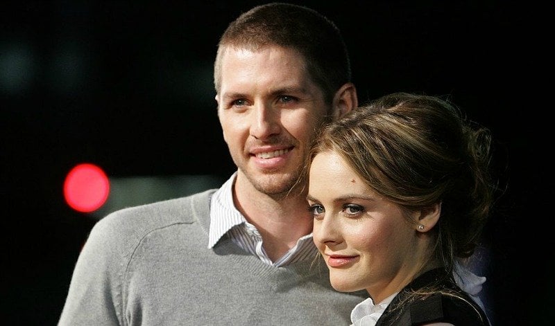 Alicia Silverstone and Christopher Jarecki pose together on the red carpet.