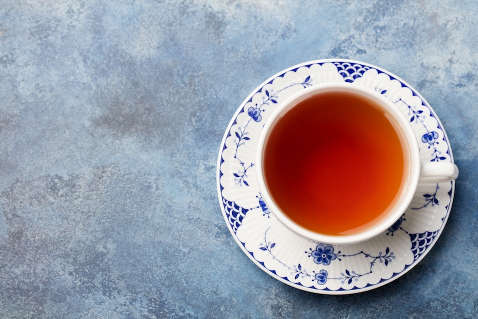 Cup of tea on a blue stone background