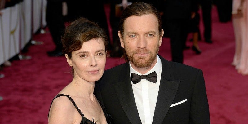 Ewan McGregor and Eve Mavrakis pose together on the red carpet. Ewan McGregor and Eve Mavrakis pose together on the red carpet.