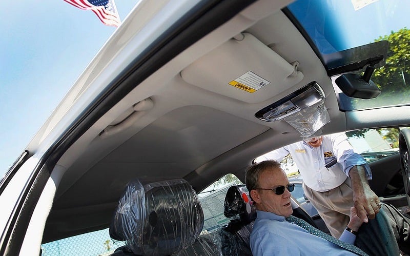 PLANTATION, FL - APRIL 03: Peter Tesche (L) is helped by car salesman Marty Israel as he shops for a car at Rick Case Plantation Hyundai on April 3, 2012 in Plantation, Florida. Reports indicate that automakers expect to have sold more than 1.4 million vehicles in March, about 15 percent more than a year ago and the most since 2007.