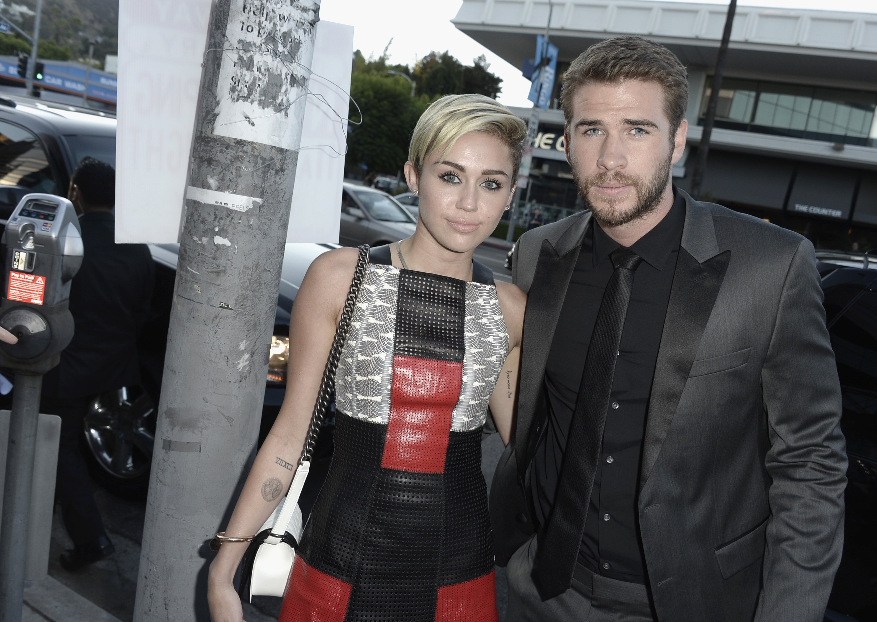 Actress Miley Cyrus and actor Liam Hemsworth attend the premiere of Relativity Media's "Paranoia" at the DGA Theater