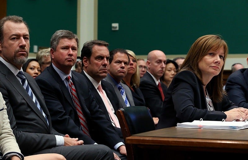 Mary Barra, CEO of General Motors, speak to Congress while GM executives look on in June 2014.