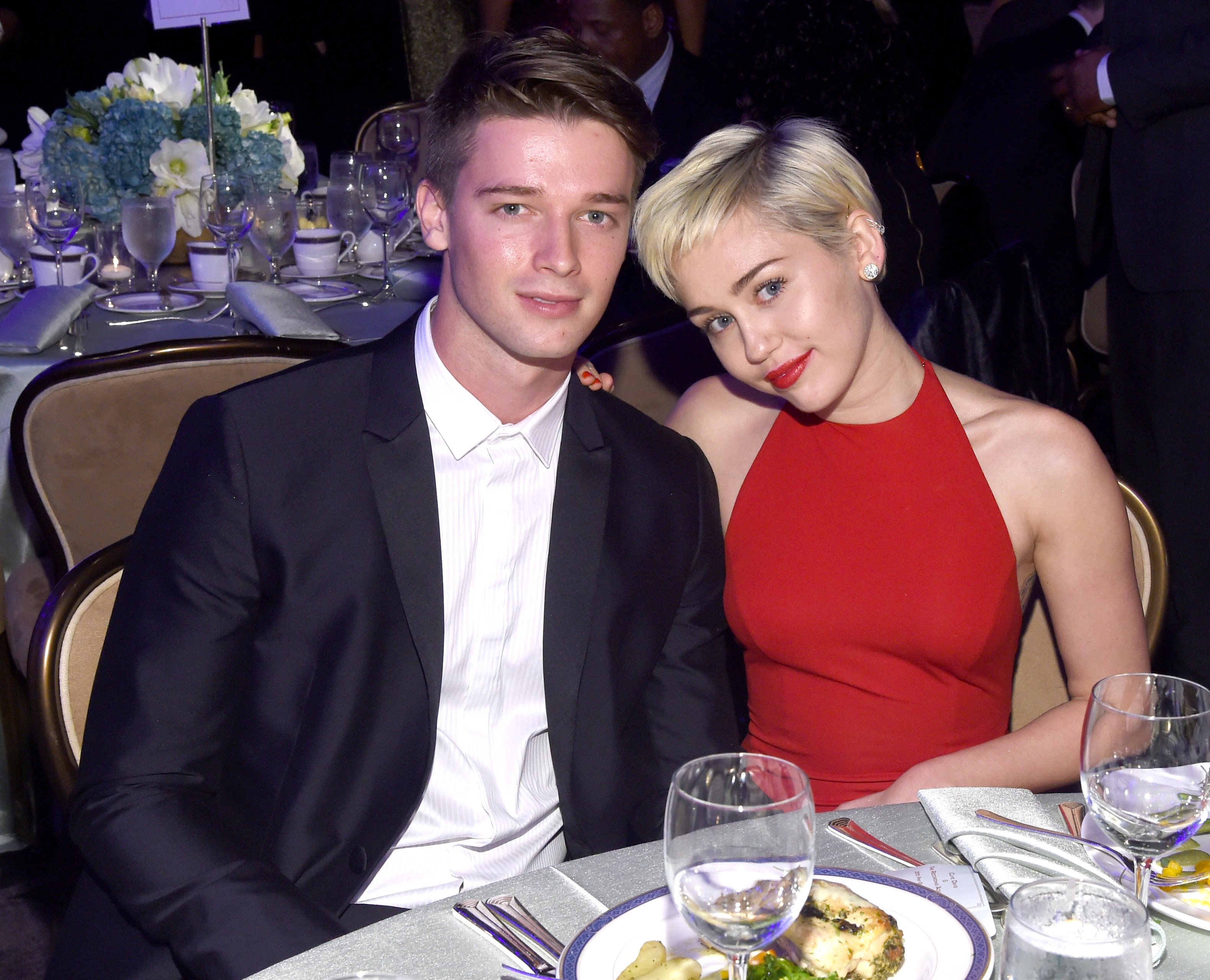 Miley Cyrus (R) and Patrick Schwarzenegger attend the Pre-GRAMMY Gala and Salute to Industry Icons Miley Cyrus (R) and Patrick Schwarzenegger attend the Pre-GRAMMY Gala and Salute to Industry Icons