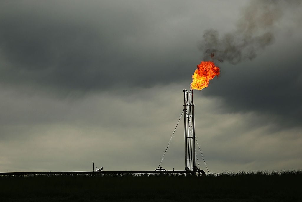 Natural gas is flared off at a plant outside of the town of Cuero, Texas