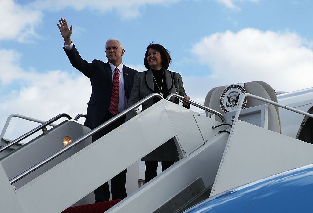 Vice President Mike Pence (L) waves with his wife Karen before they board Air Force Two January 26, 2017 at Joint Base Andrews in Maryland. Vice President Pence is heading to Philadelphia to speak at the Congress of Tomorrow Republican Member Retreat.