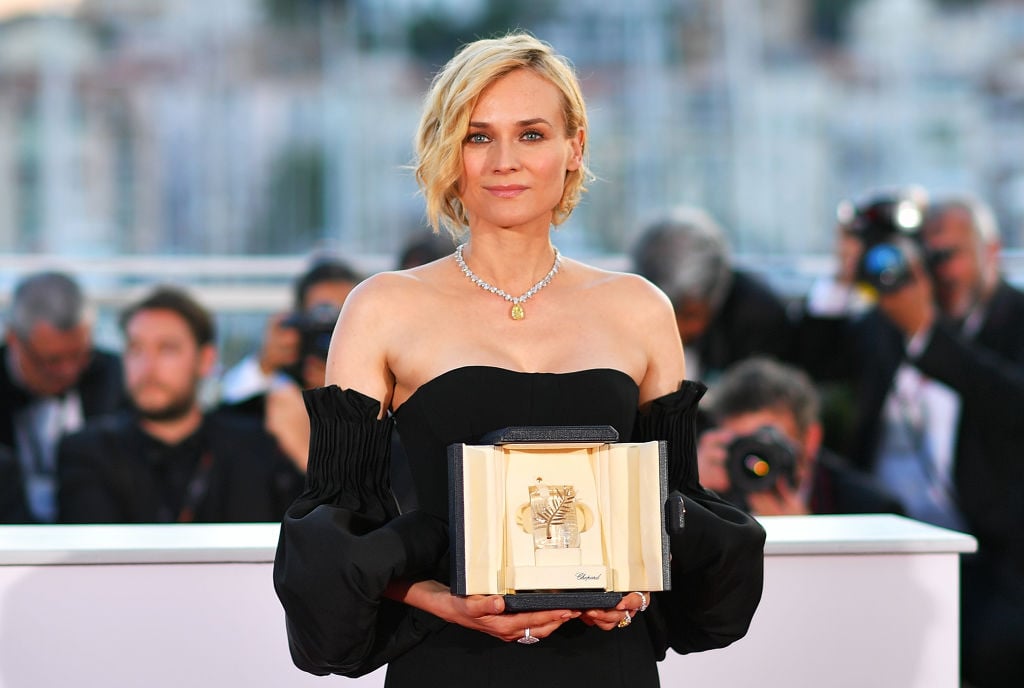 Actress Diane Kruger poses holding her Best Actress prize at Cannes Film Festival in 2017.