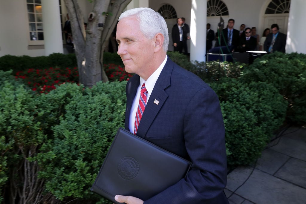 Vice President Mike Pence walks into the Rose Garden. |