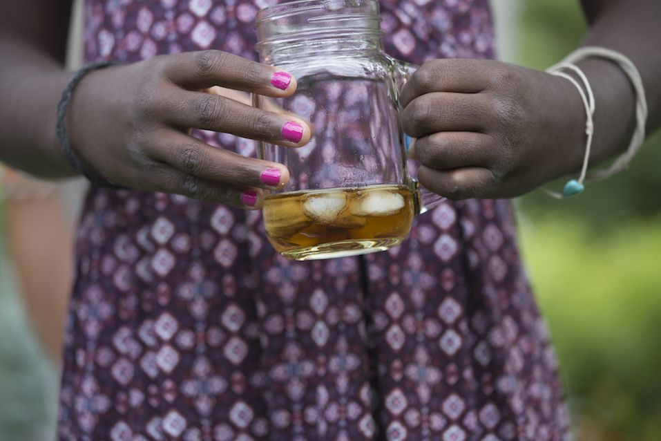 Girl Holding a Cup of Ice Tea