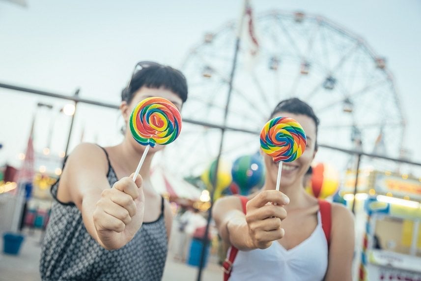Young Women eating Lollipop Young Women eating Lollipop