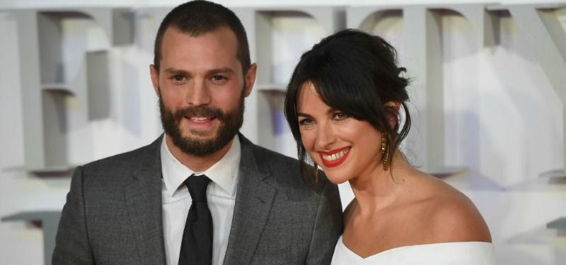 Jamie Dornan and Amelia Warner pose together on the red carpet. Jamie Dornan and Amelia Warner pose together on the red carpet.