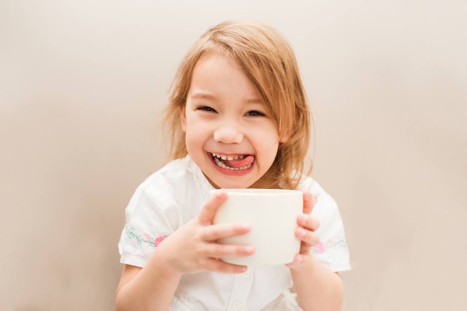Little cute and sweet girl with tea