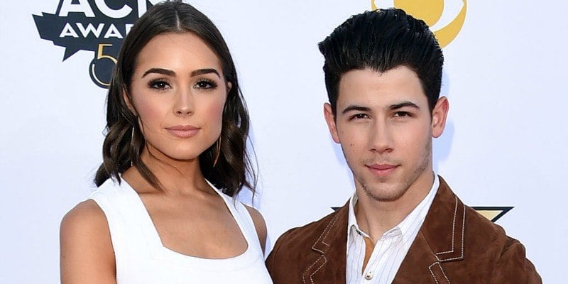 Nick Jonas and Olivia Culpo pose together on the red carpet. Nick Jonas and Olivia Culpo pose together on the red carpet.
