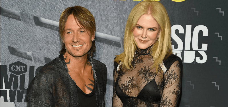 Keith Urban and Nicole Kidman pose together on the red carpet.