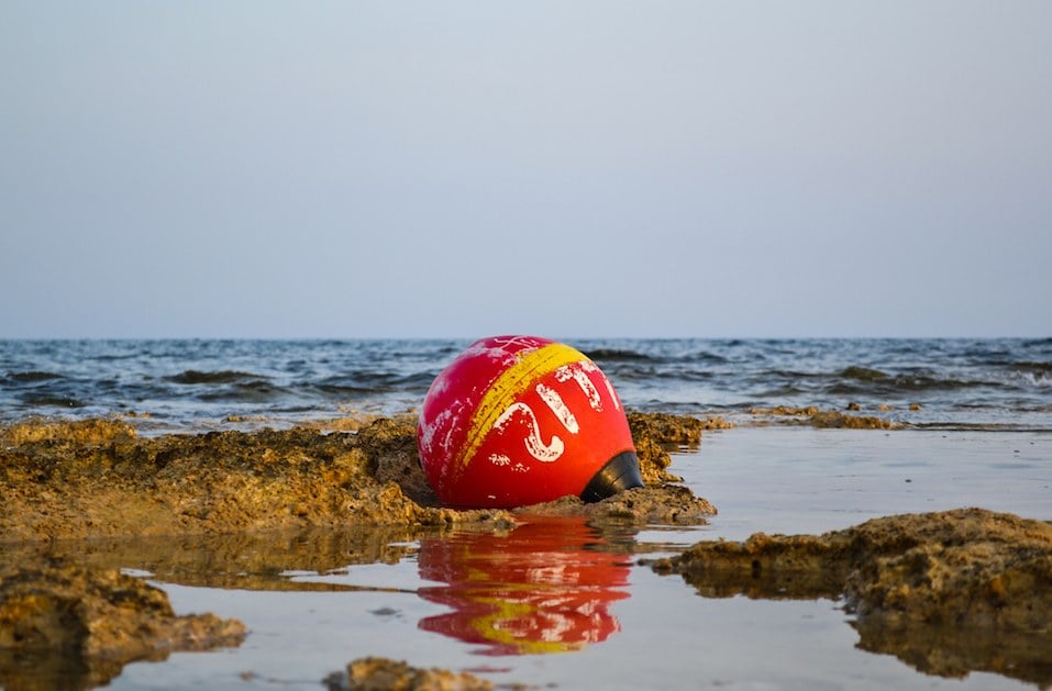 Old buoy of red color