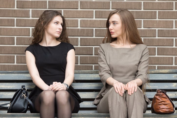 two business rivals women looking at each other two business rivals women looking at each other