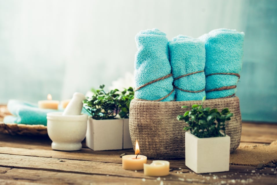 Spa and wellness setting with flowers and towels