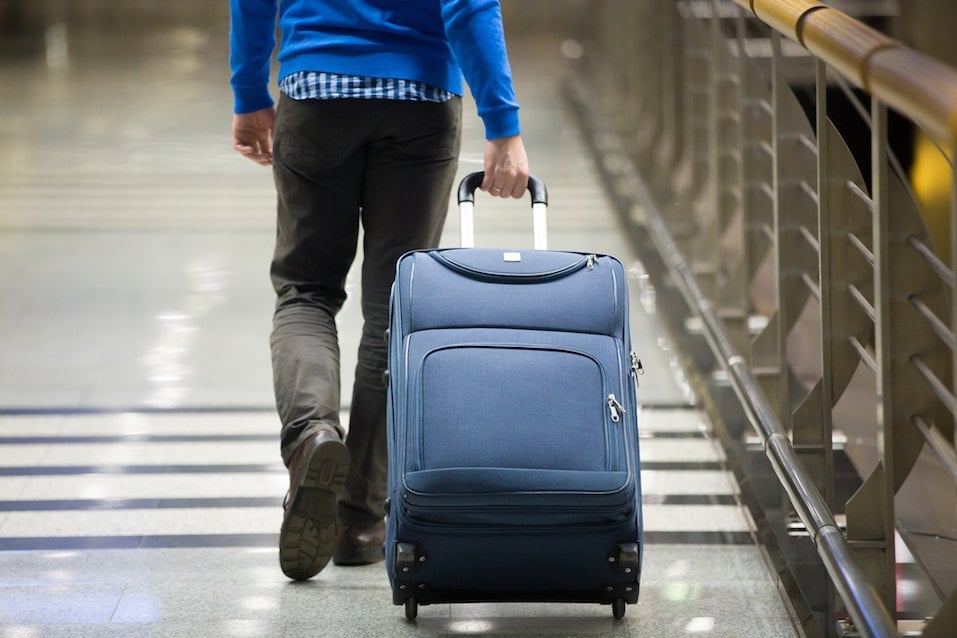 Traveler pulling suitcase
