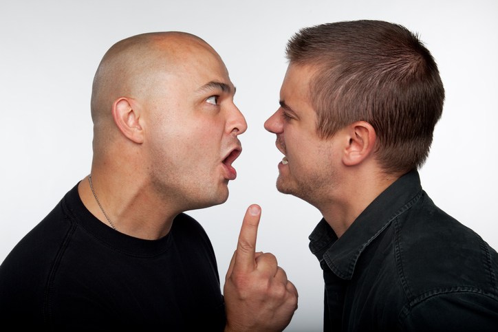 Two guys having an argument in each other's faces