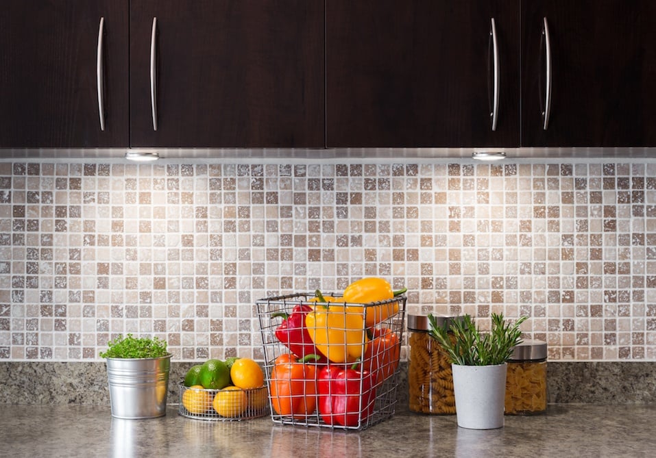 Vegetables, fruits and herbs in a kitchen with cozy lighting