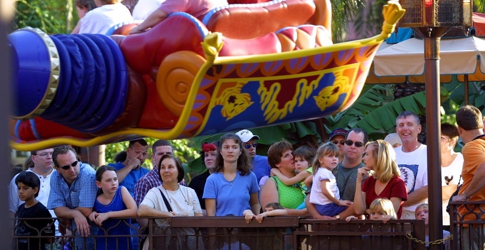 People stand in line to ride The Magic Carpets of Aladdin ride at Walt Disney World's Magic Kingdom