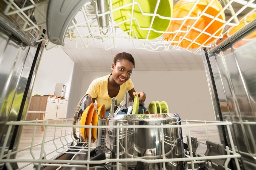 African Woman Removing Plate