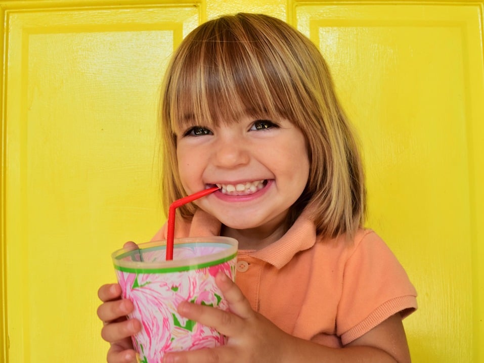 Happy child has a drink