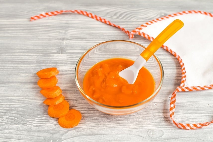 carrot puree on wooden background