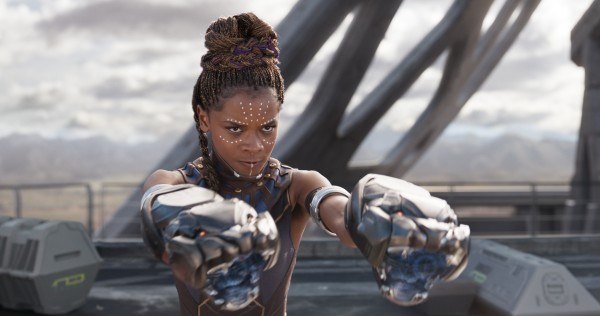 Shuri holds up her panther-shaped glove weapons in Black Panther