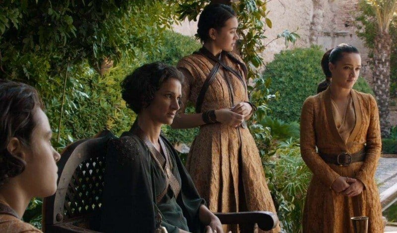 The Sand Snakes are standing together in a garden. The Sand Snakes are standing together in a garden.