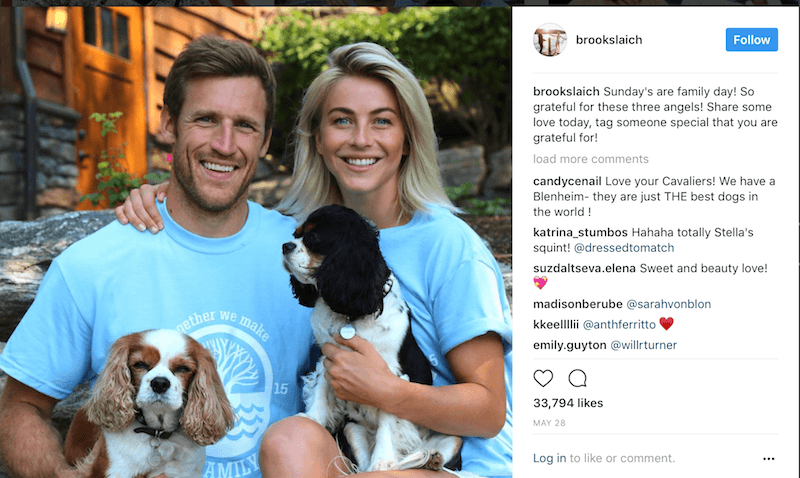 Brooks Laich and Julianne Hough pose in blue T-shirts holding their dogs Brooks Laich and Julianne Hough pose in blue T-shirts holding their dogs