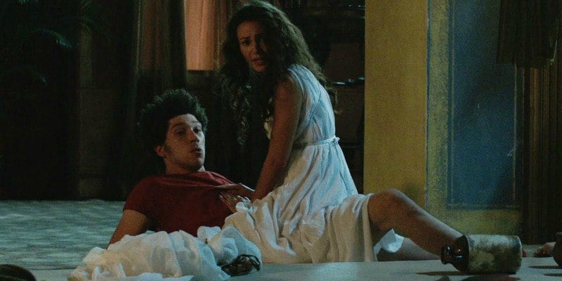 Michelle Keegan wears a white dress while straddling Joel Fry in Plebs. Michelle Keegan wears a white dress while straddling Joel Fry in Plebs.