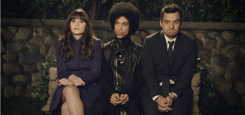 Prince sits between Jess and Nick on New Girl. Prince sits between Jess and Nick on New Girl.