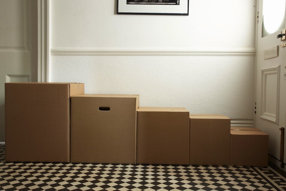 packing boxes in order of size in hallway