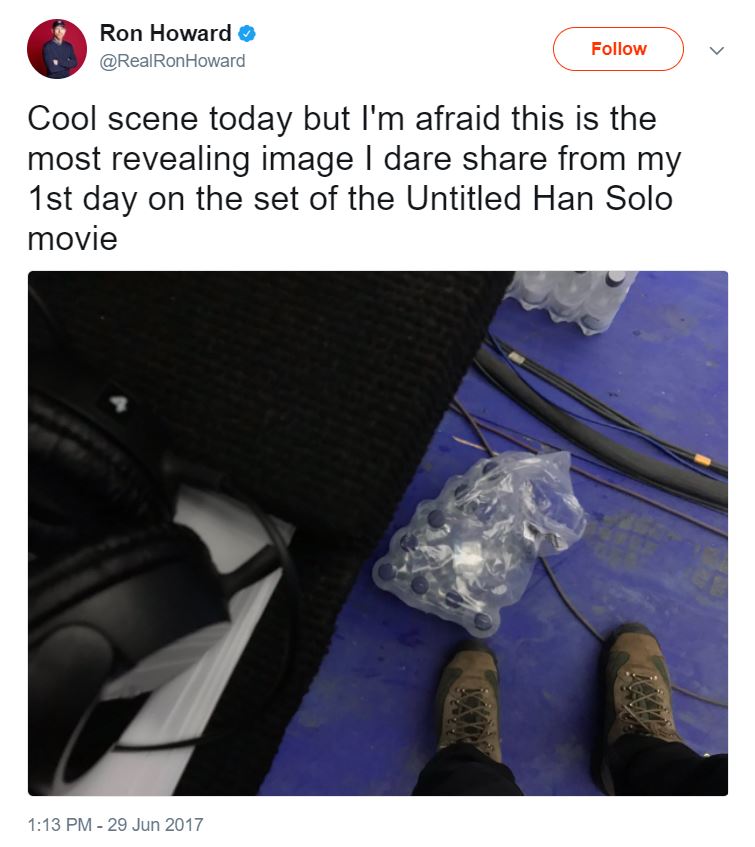 An image of shoes, water bottles, and film equipment from above with the text "Cool scene today but I'm afraid this is the most revealing image I dare share from my 1st day on the set of the Untitled Han Solo movie" from @RealRonHoward