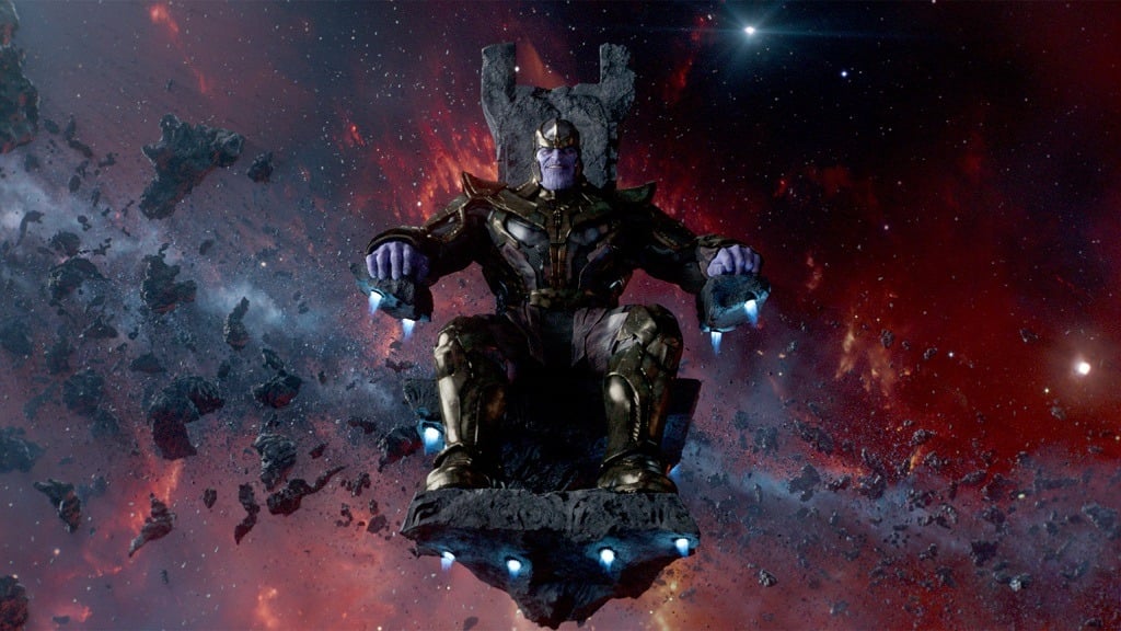 Thanos sitting on a throne suspended in space surrounded by darkness