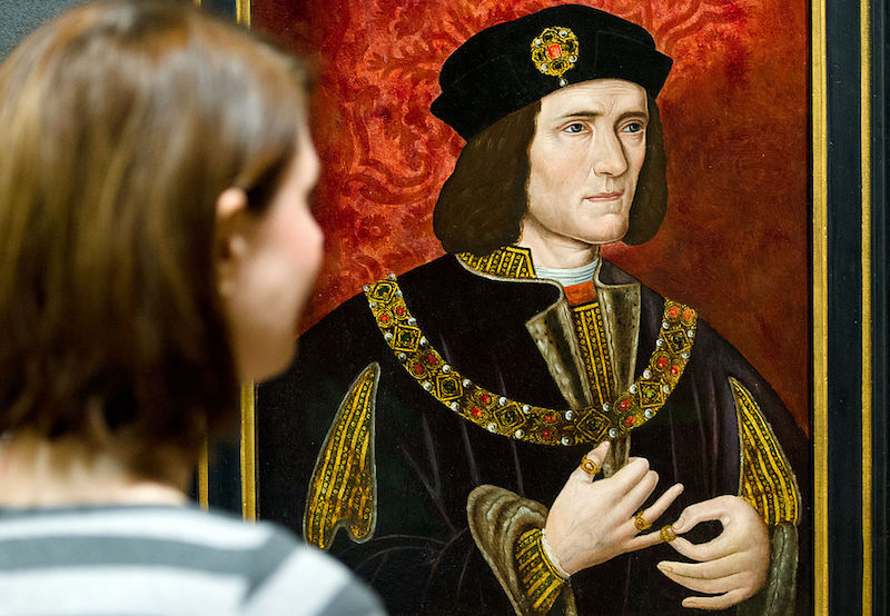 A woman looks at a painting of Britain's King Richard III.
