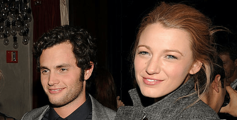 Blake Lively and Penn Badgley together at an event. Blake Lively and Penn Badgley smile together at an event.