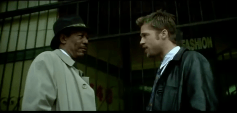 Brad Pitt and Morgan Freeman stand outside and face each other in Seven Brad Pitt and Morgan Freeman stand outside and face each other in Seven