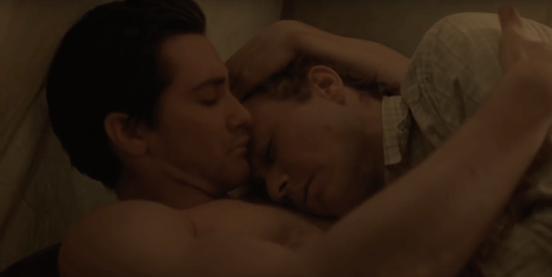 Two men lay next to each other in Brokeback Mountain