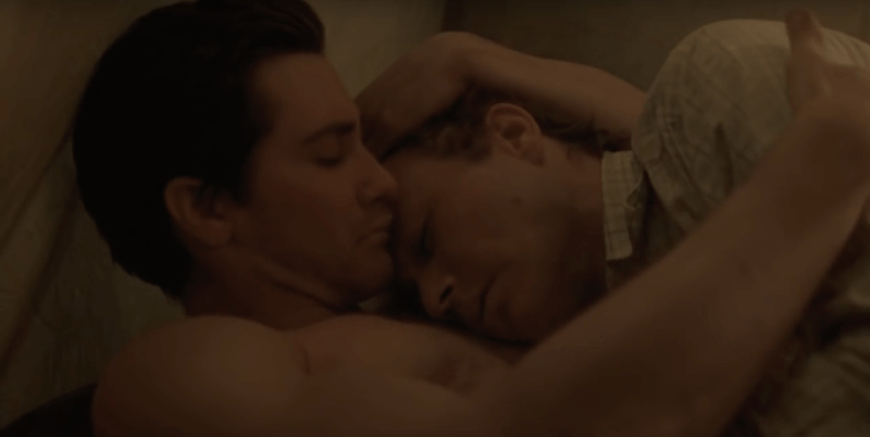 Two men lay next to each other in Brokeback Mountain Two men lay next to each other in Brokeback Mountain