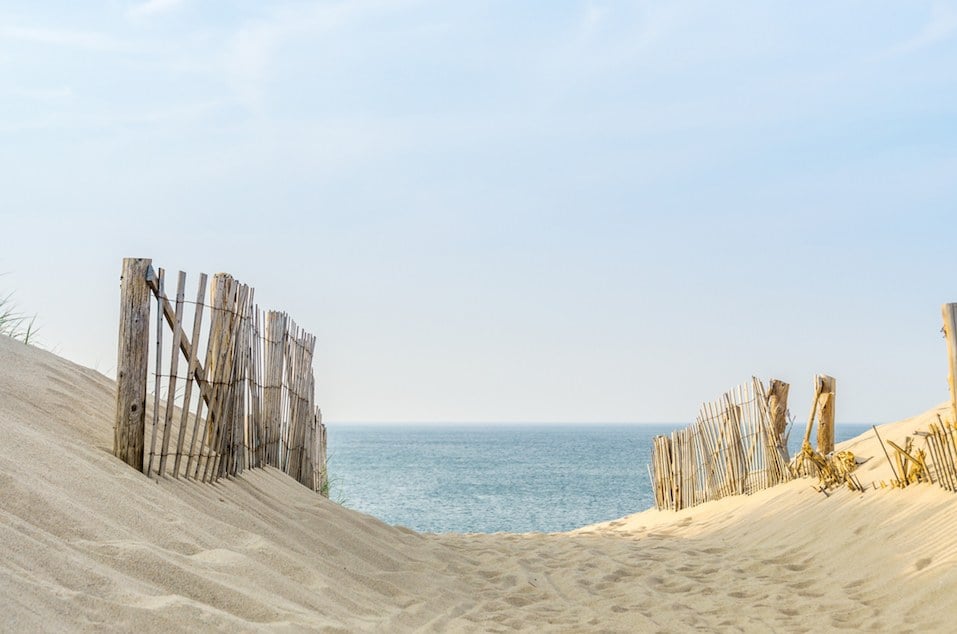 two fences frame the pathway to the beach at Provincetown Massachusetts