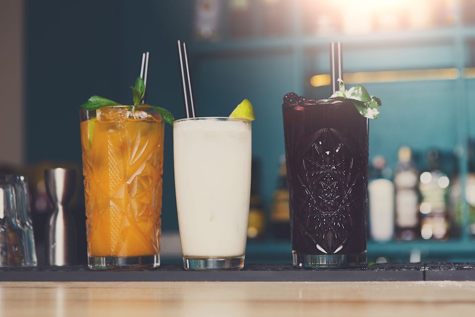 Creative exotic alcoholic cocktails in bar
