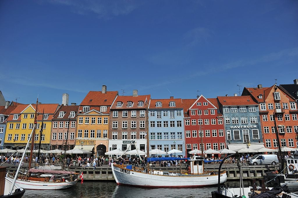 Colorful houses and boats in the Nyhavn district in Copenhagen. Coulourful houses and boats can be seen in the Nyhavn district in Copenhagen