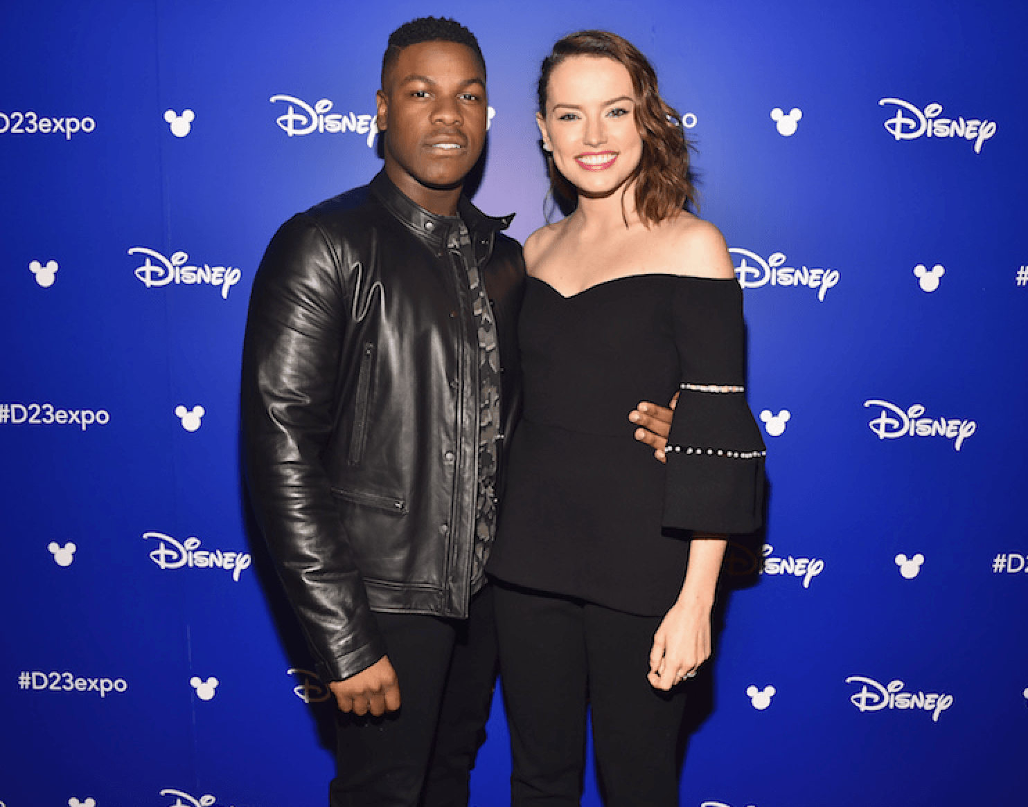John Boyega poses with Daisy Ridley at the Star Wars Celebration Day event. 