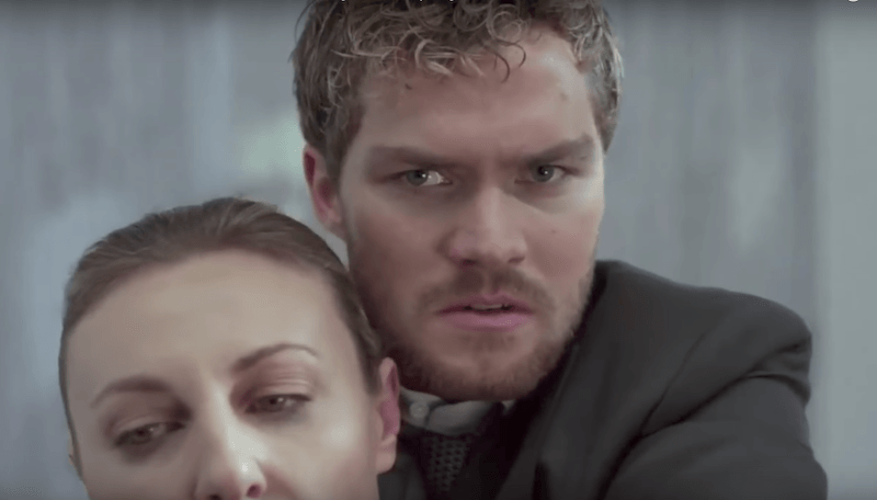 Danny Rand holds an enemy in a chokehold. Danny Rand holds an enemy in a chokehold.